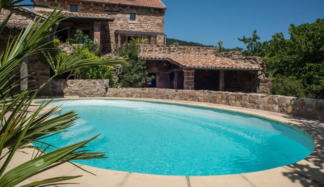 Large stone house classified 4 épis, emblematic of southern Ardèche.