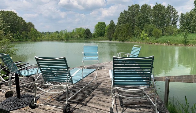 Large stone house with hot tub pond, secluded acerage, up to three families