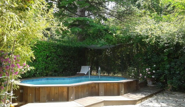 Large studio in garden with pool