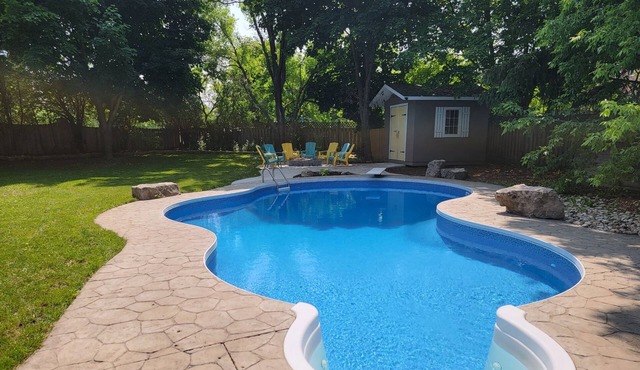 Large suite with king bed, pool, and parking!