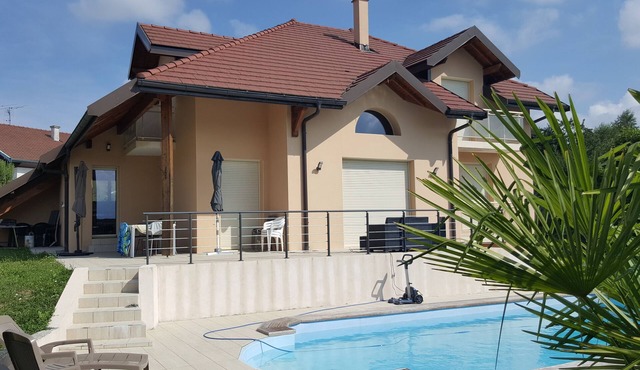 large swimming pool with large sun terraces