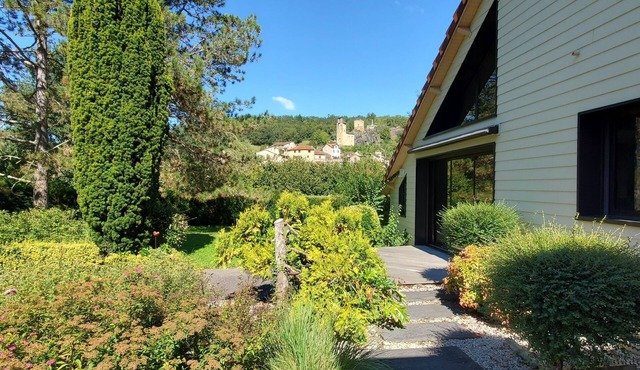 Large upscale house, swimming pool and wooded grounds, view of Fort d'Aubin