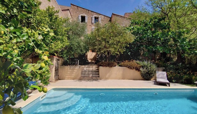 Large vacation home in Tautavel with wooded garden and private pool.