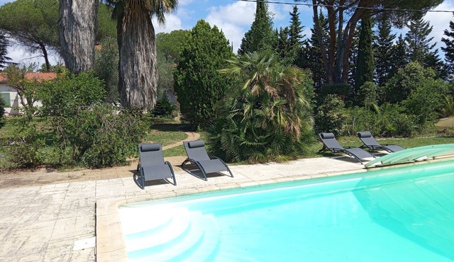 Large villa with 11x5m pool in 7700 M2 grounds. Veranda and multiple terraces.