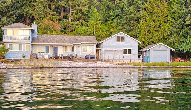 Large waterfront beach house with hot tub, game room, & private beach access