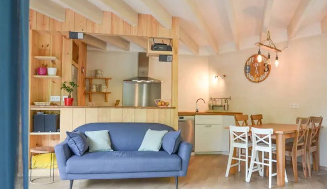 Le colibri, wooden house near river and forest