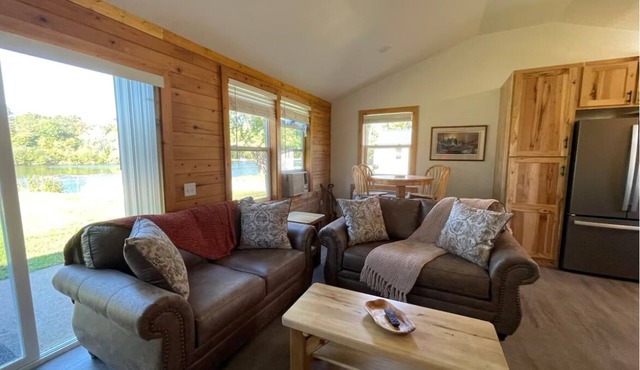 Legacy farm waterfront cottage in welcoming Eau Claire with WiFi, AC
