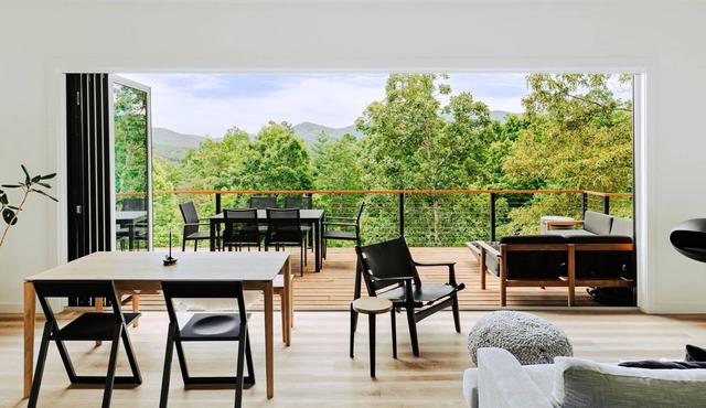 Letting Geaux is a mountain retreat designed for a stylish winter escape. Enjoy a private hot tub, full kitchen, ensuite bedrooms, modern interiors, game room, expansive decks and fire pit. Perfect for slow mornings, cozy evenings and starry skies.