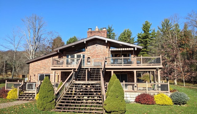 Level lakefront, family-friendly, hot tub, low fees, private dock