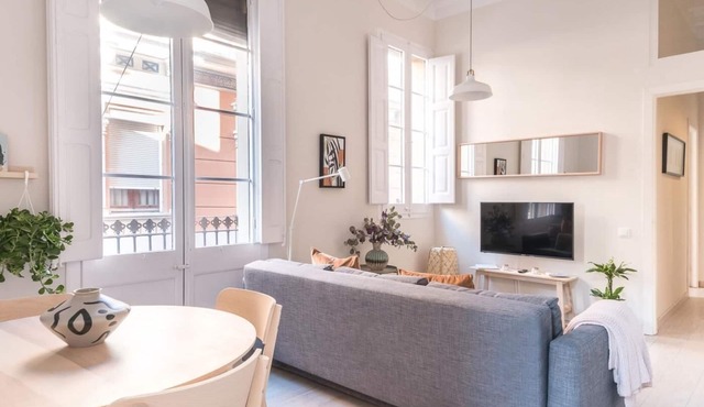Light, cozy terrace and local life in Gracia