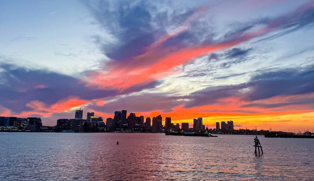 Light-filled condo near airport and city with AC, W/D, patio, balcony, & hot tub