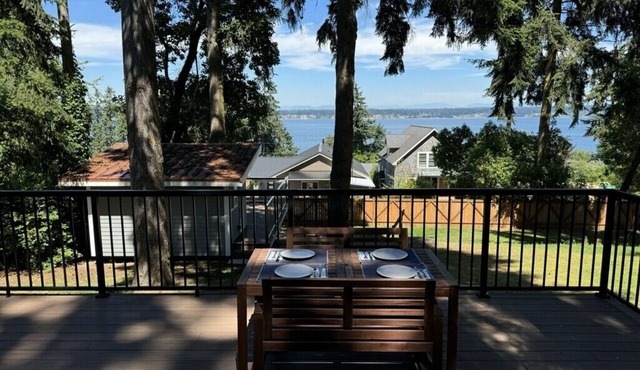 Light-filled home with Puget Sound view, great deck, fenced yard & fireplace