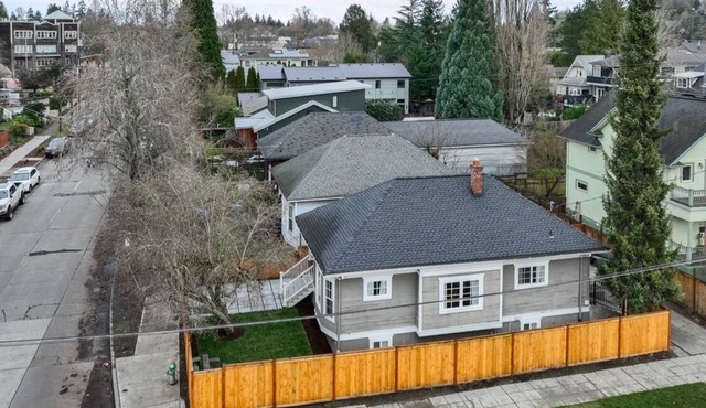 Light-filled Seattle home featuring modern comforts and a tranquil fountain