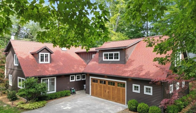 Listen to the waves in this charming, two-story home is nestled away on quiet &