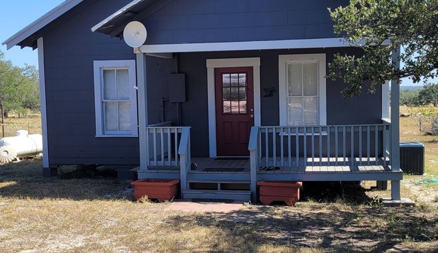 Little 1950's country cottage is peaceful and simple.