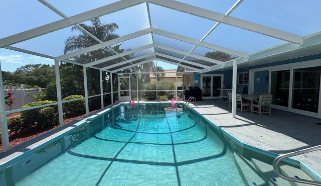 Little bit of heaven, 3BR 2BA heated pool, gorgeous yard & <10 min to the beach!