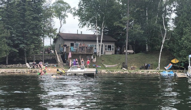 Little Long Lake lakefront cottage with its own beach and private drive.