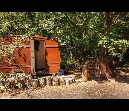 little vintage caravan with cosy log burner