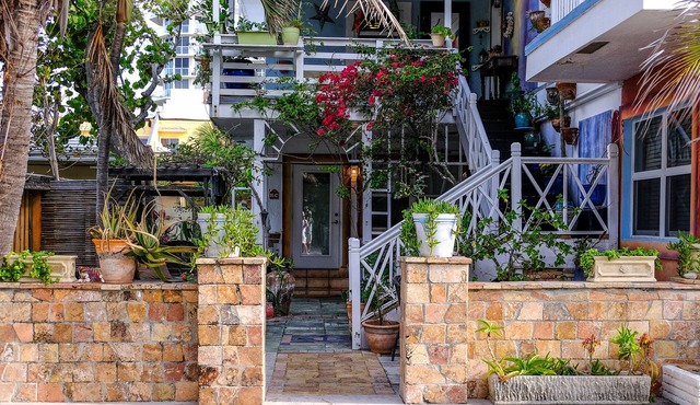 Located steps from the ocean, offering true beach living.