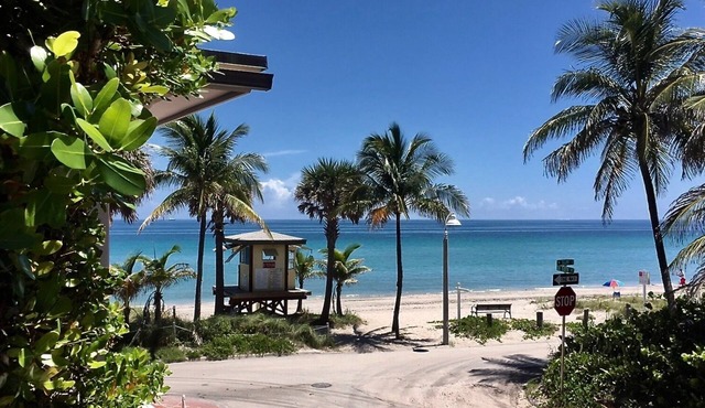 Located steps from the ocean, offering true beach living