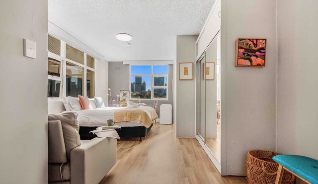 Location and lifestyle in a cute luxe studio with stunning city views