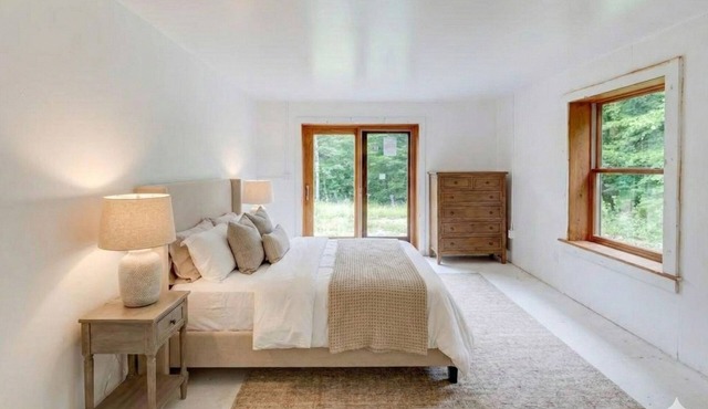 Loft like 2BR house plus sleeping loft on 100 private wooded acres.