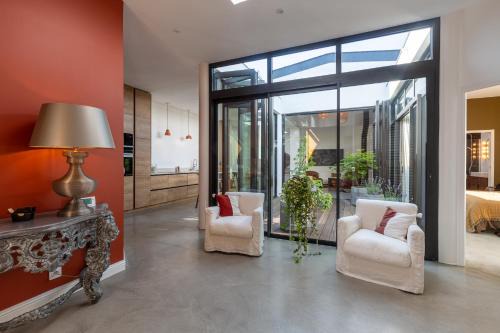 Loft lumineux haut de gamme avec patio privé