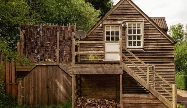 Lofty first floor barn conversion in stunning secluded setting.