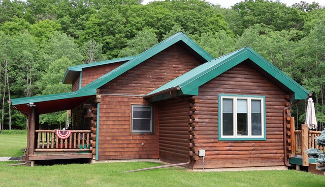 Log Cabin Living in this rustic yet refined home with ample space and privacy!
