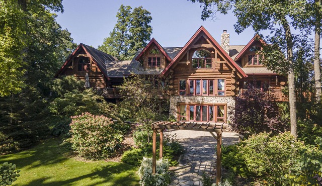 Log Cabin Mansion fronting Strawberry and Bass Lake with large oversized suites.