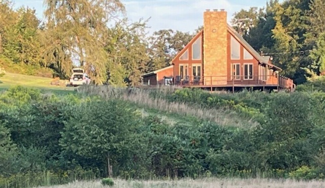 Log cabin style dupex on 155 acres wooded farm land