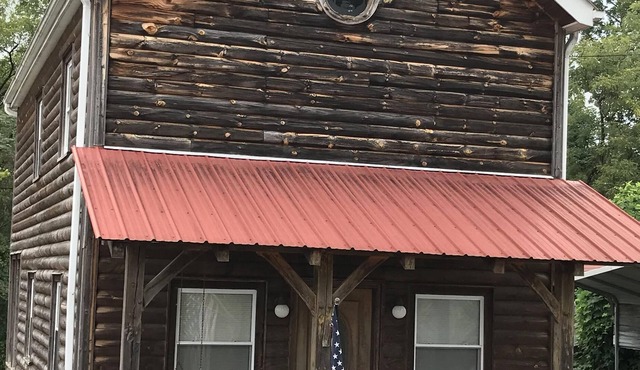 Log cabin with country ambiance located within city conveniences