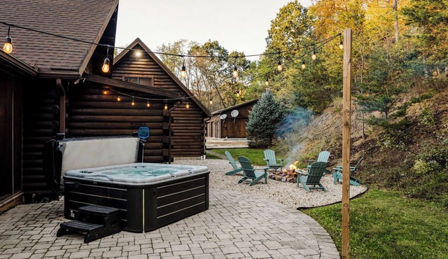 Log Cabin with living room fireplace and hot tub