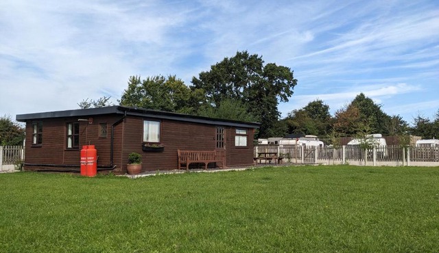 Log cabin with secure garden