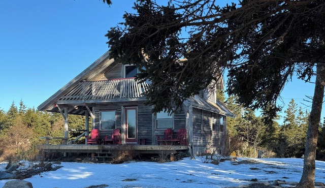 Log chalet on a high bluff overlooking the Atlantic Ocean