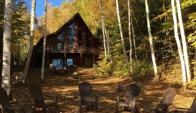Log Home Luxury awaits on the west shore of AuTrain Lake!