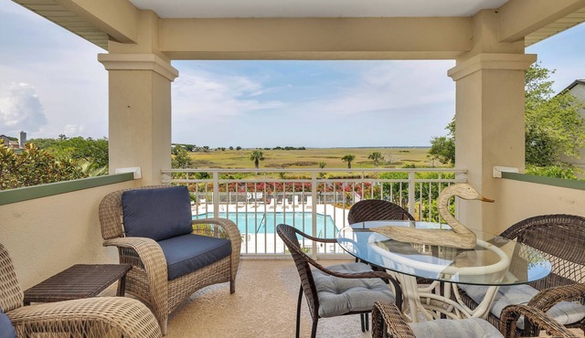 Long distance marsh views and community pool.