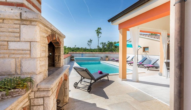 Look forward to vacationing in this vacation home with pool and views of the green surroundings!