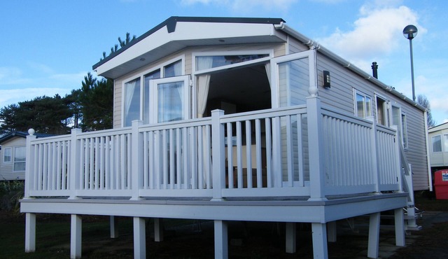 Lotus 2 bedroom dog friendly caravan with veranda offers a stunning sea view.