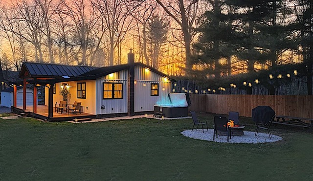 Lovely 2-bedroom cottage with covered porch, hot tub and campfire area.