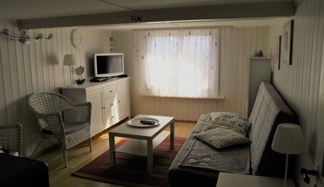 Lovely attic apartment in a central location in the middle of the mountains and close to the lake
