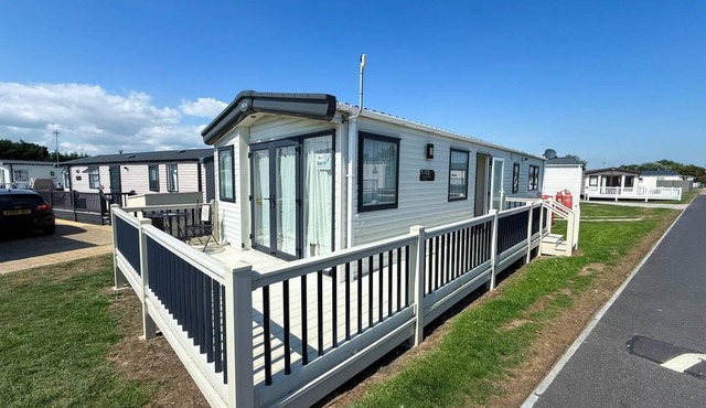 Lovely caravan with decking at Suffolk Sands Holiday Park ref 45017B