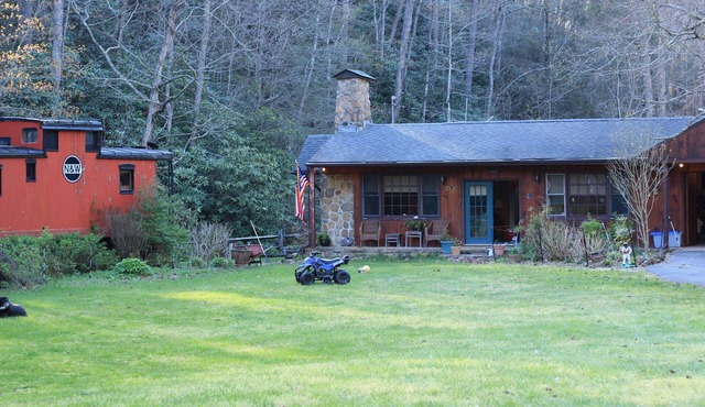 Lovely cottage by stream with caboose and covered bridge over trout stream