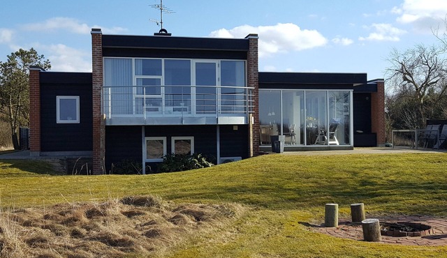 Lovely holiday house located at the 1st row close to the beach. Free Wi-fi.