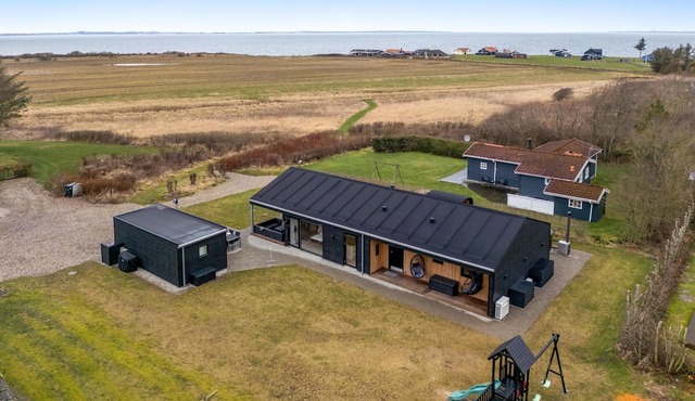 Lovely holiday home with mini golf course, sauna, wilderness bath and view of.