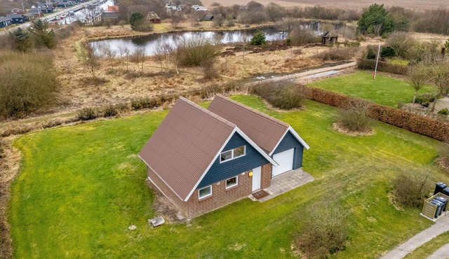Lovely holiday home with a view of the fishing lake and the fjord.