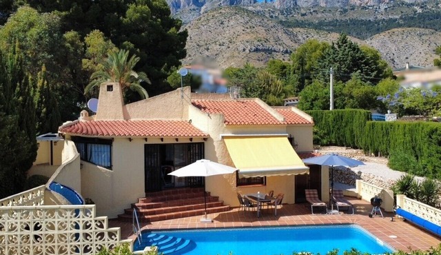 Lovely holiday home with a sun terrace, pool and own garden