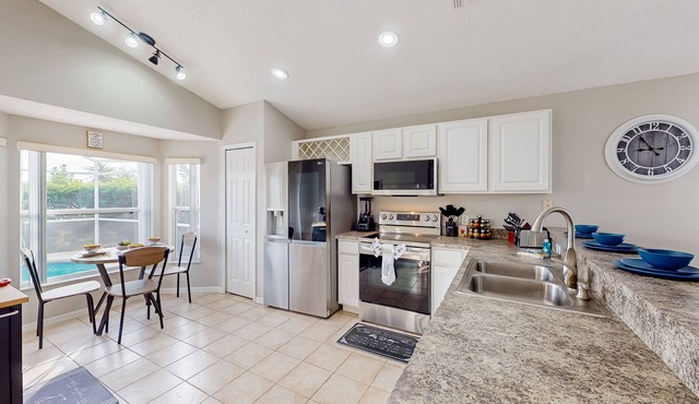 Lovely home with a heated pool, open-concept interior, central AC, and W/D
