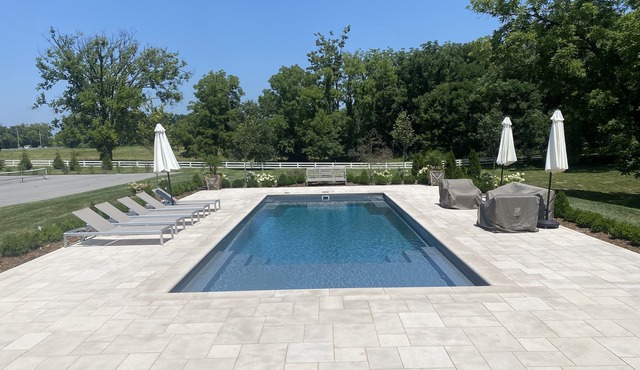 Lovely home with river views on 6 acres with pool and chipping green!