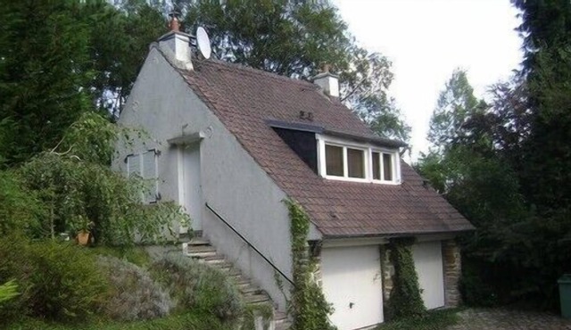 Lovely little house of gardian in a park